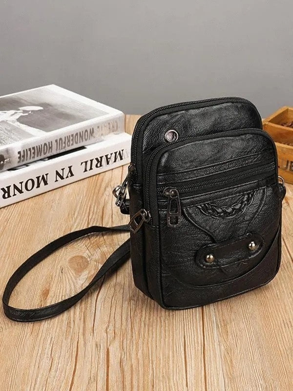 Crossbody-veske i vasket skinn med nitter